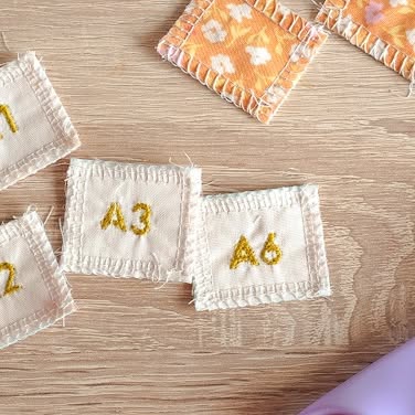 Instagram post by @the.weekendquilter for Fiskars. Caption reads: Skip the paper labels and stitch up a set of these....