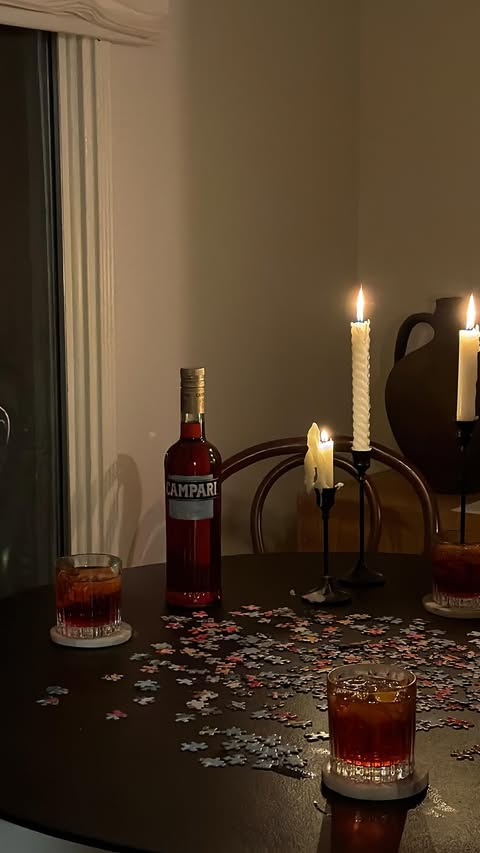 Instagram post by @michelleinfusino for Campari. Caption reads: [...] of holiday hosting: negronis & dinner....