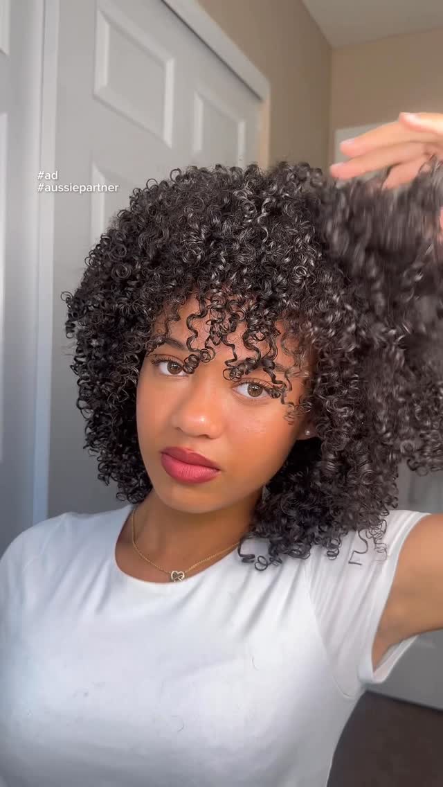 Instagram post by @nevaexh_ for Aussie Hair. Caption reads: #ad #aussiepartner | Curls Girls over everything!!....