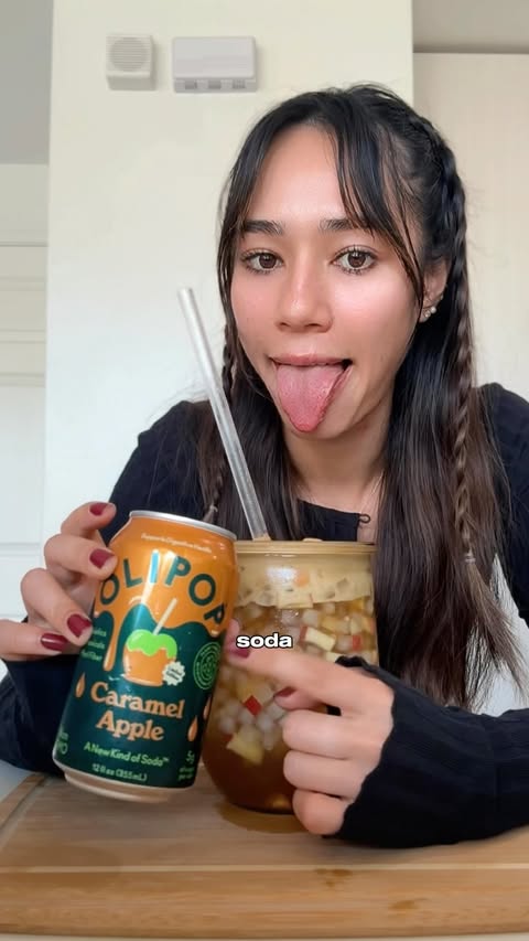 Instagram post by @clairesawa for OLIPOP. Caption reads: [...] Ingredients: - 1 can Caramel Apple....