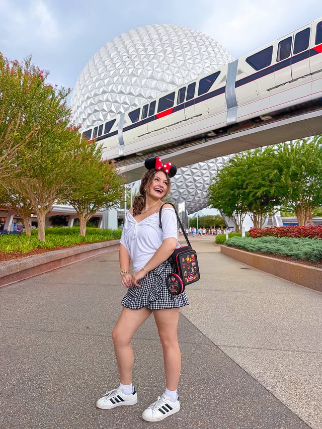 Instagram post by @pincessshannon for Disney Parks. Caption reads: [...] around the world (showcase) 🐭✨ @disneyparks....