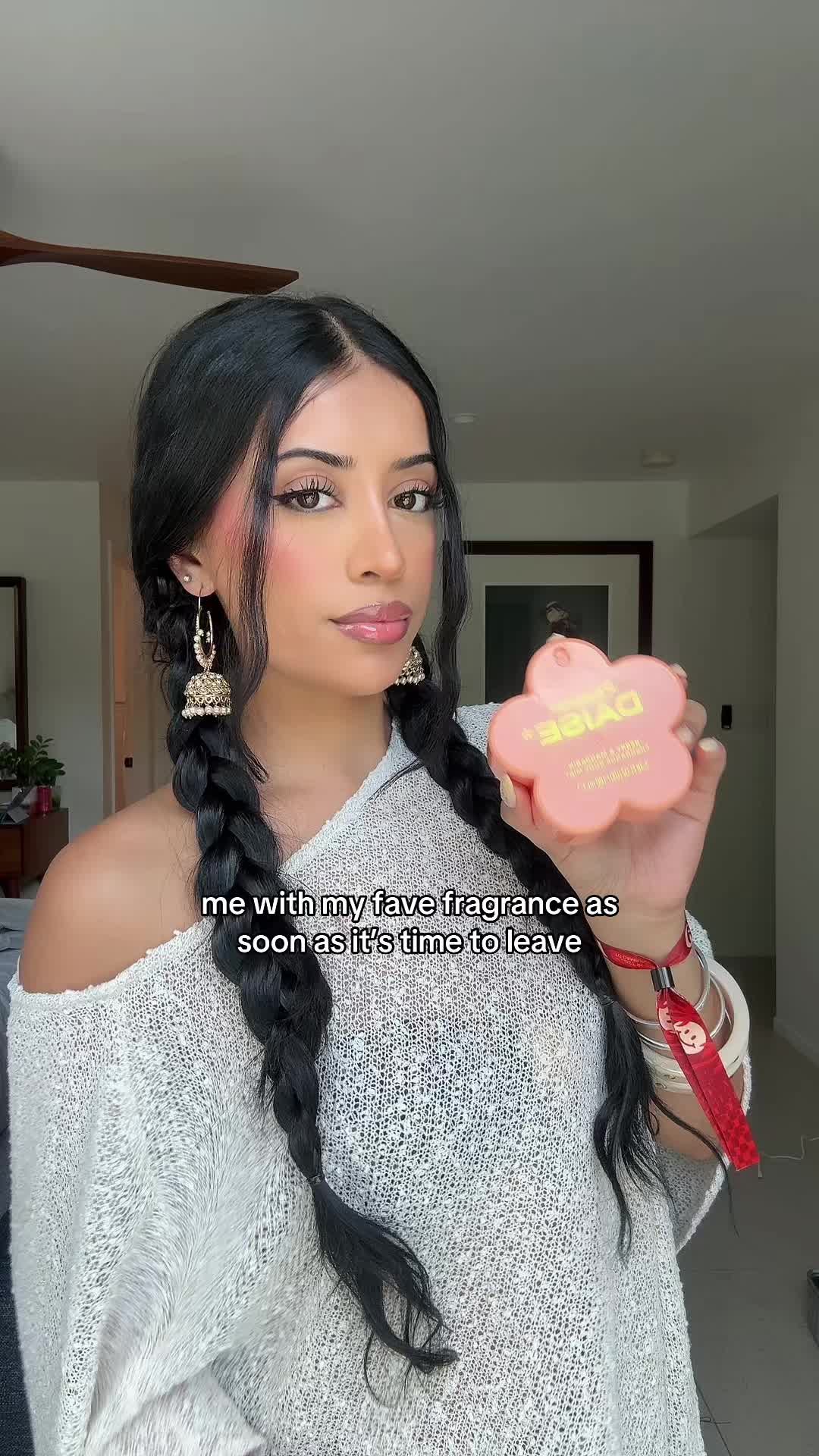 TikTok post by @alishaakaurr for daisebeauty. Caption reads: using peachy @daisebeauty fragrance in mandarin....