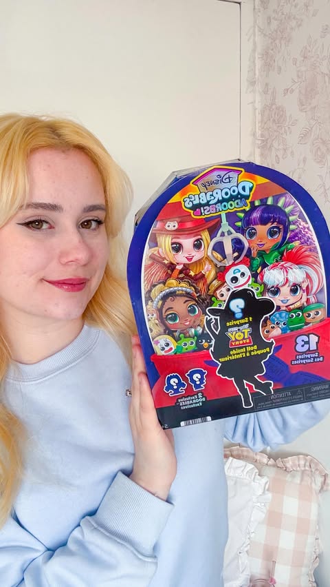 Instagram post by @magicallyronni for Disney Doorables. Caption reads: #AD Let’s unbox the brand new Disney Doorables....
