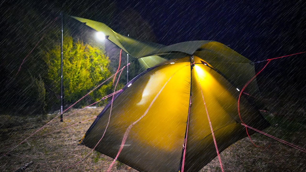 YouTube post by @AbelandVictoria for Suunto. Caption reads: CAMPING In HEAVY RAIN - Storm INCOMING - Tent....