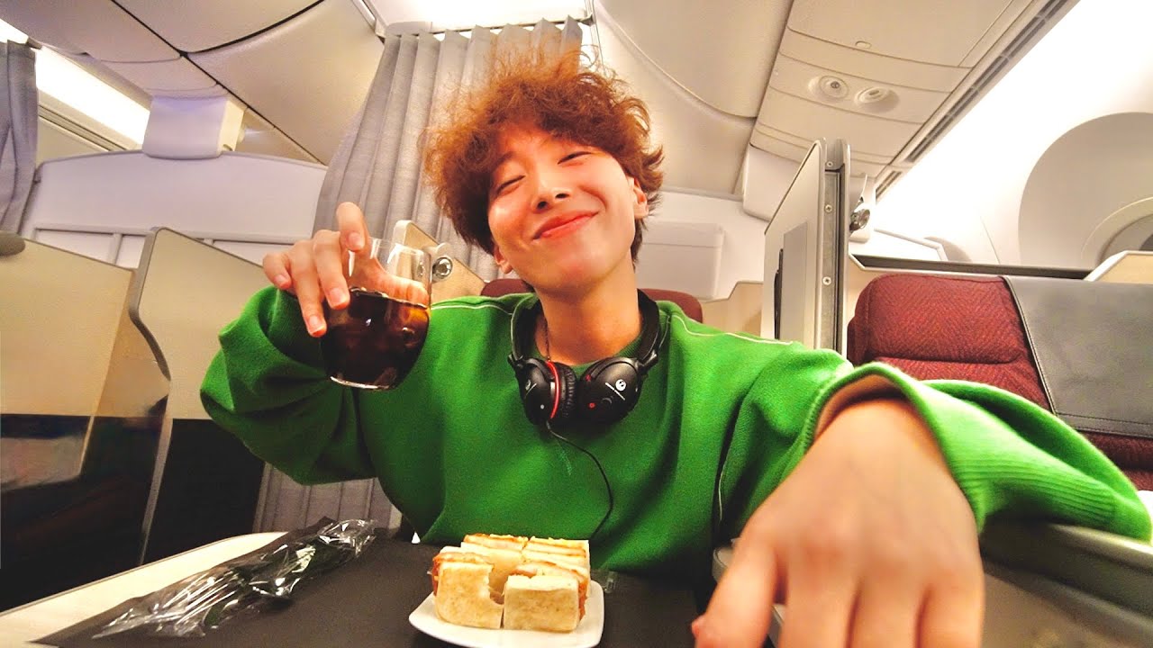 YouTube post by @imomuhi for Qoo10. Caption reads: [Flight Routine] It was my first time going to....