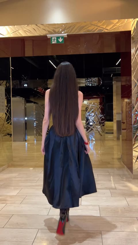 Instagram post by @m_angelina_k for Uoozee. Caption reads: grace in every step 

dress @uoozee_official 

use....