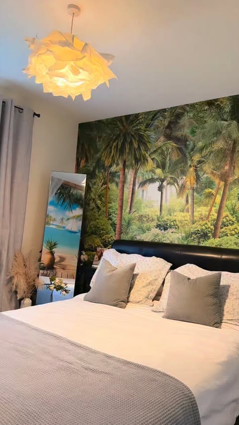 Instagram post by @emilyworld10 for Photowall. Caption reads: [...] into a little tropical paradise with....