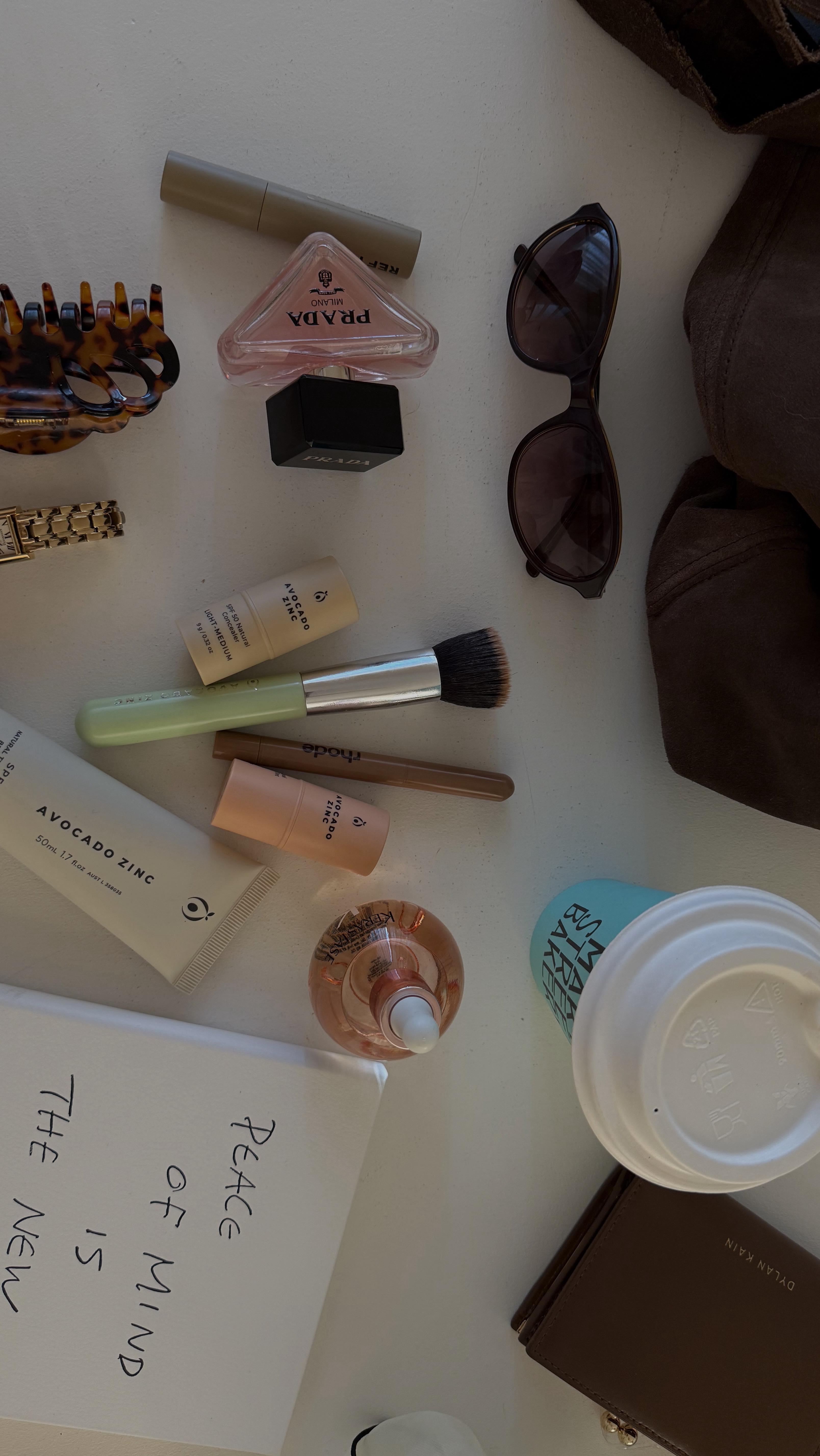 Instagram post by @emdavies___ for Adore Beauty. Caption reads: [...] packed, unorganised bag 😂 lots of....