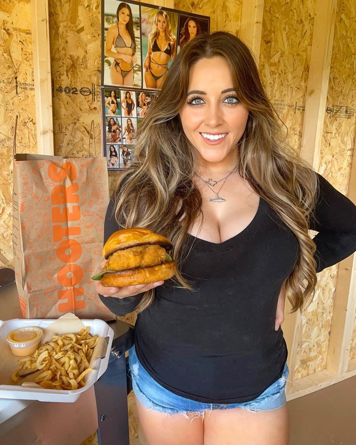 Instagram post by @ksalom for Hooters. Caption reads: [...] National Chicken Sandwich Day with @Hooters....