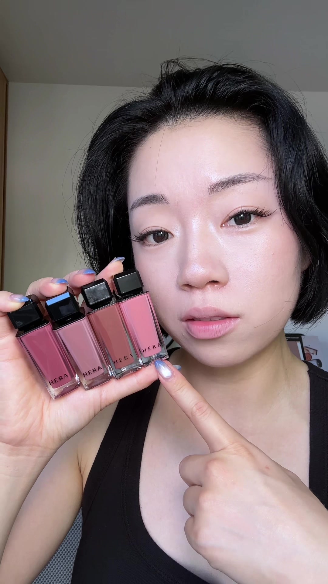 TikTok post by an influencer for HERA. Caption reads: Every Korean girl has a @HERA gloss in their purse....