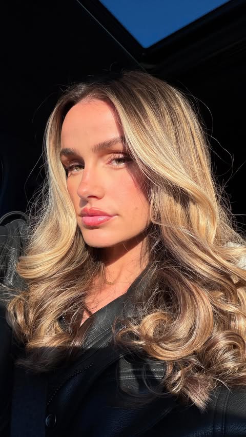 Instagram post by @sydneymaycrouch for BPerfect Cosmetics. Caption reads: [...] tanned makes everything better The....
