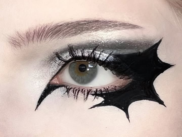 Instagram post by @gloomyfly666 for NYX Professional Makeup. Caption reads: pt. 33 - bat eyeliner 🦇 . products (*gifted): ⭐️....