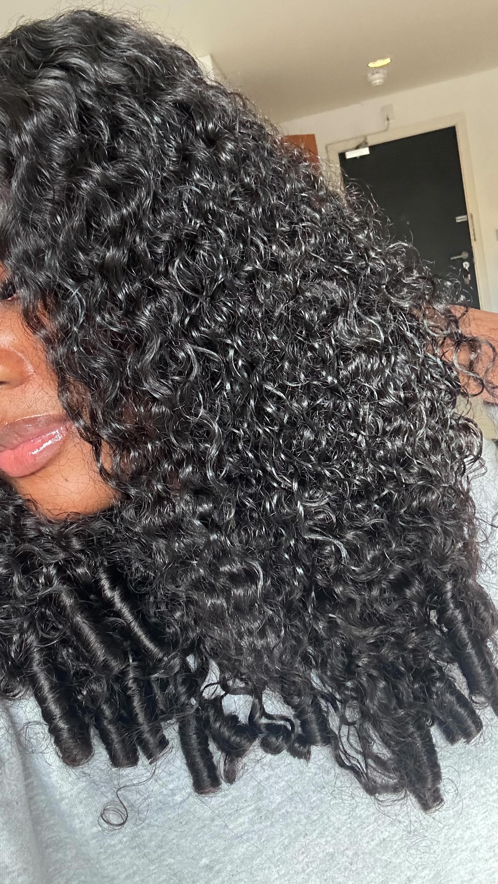 Instagram post by @forever.sylviaa_ for WigFever. Caption reads: The best Burmese curls in town! 🤏🏼😘 @wigfever....