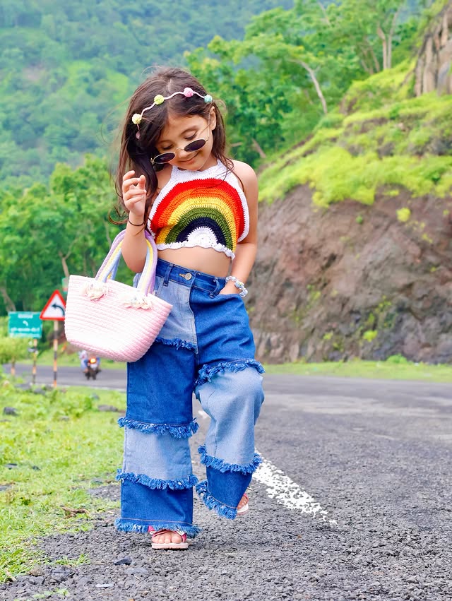 Instagram post by @ekvira12 for FirstCry. Caption reads: “Feeling the vibe of the road and the rainbow 🌈✨....