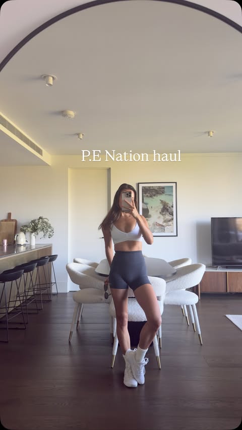 Instagram post by @nikki_obispo for P.E Nation. Caption reads: @p.e.nation Baseline Marine Blue collection is my....