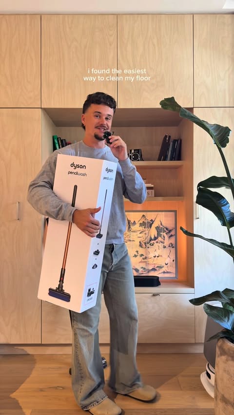 Instagram post by @samscottbills for Dyson. Caption reads: @dyson_anz just made cleaning my floor a whole....