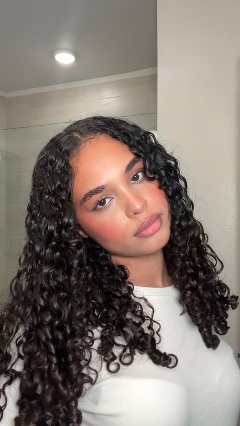 Instagram post by @mariahlovelewis for CURLSMITH. Caption reads: As curly girly @curlsmith_official Weightless Air....