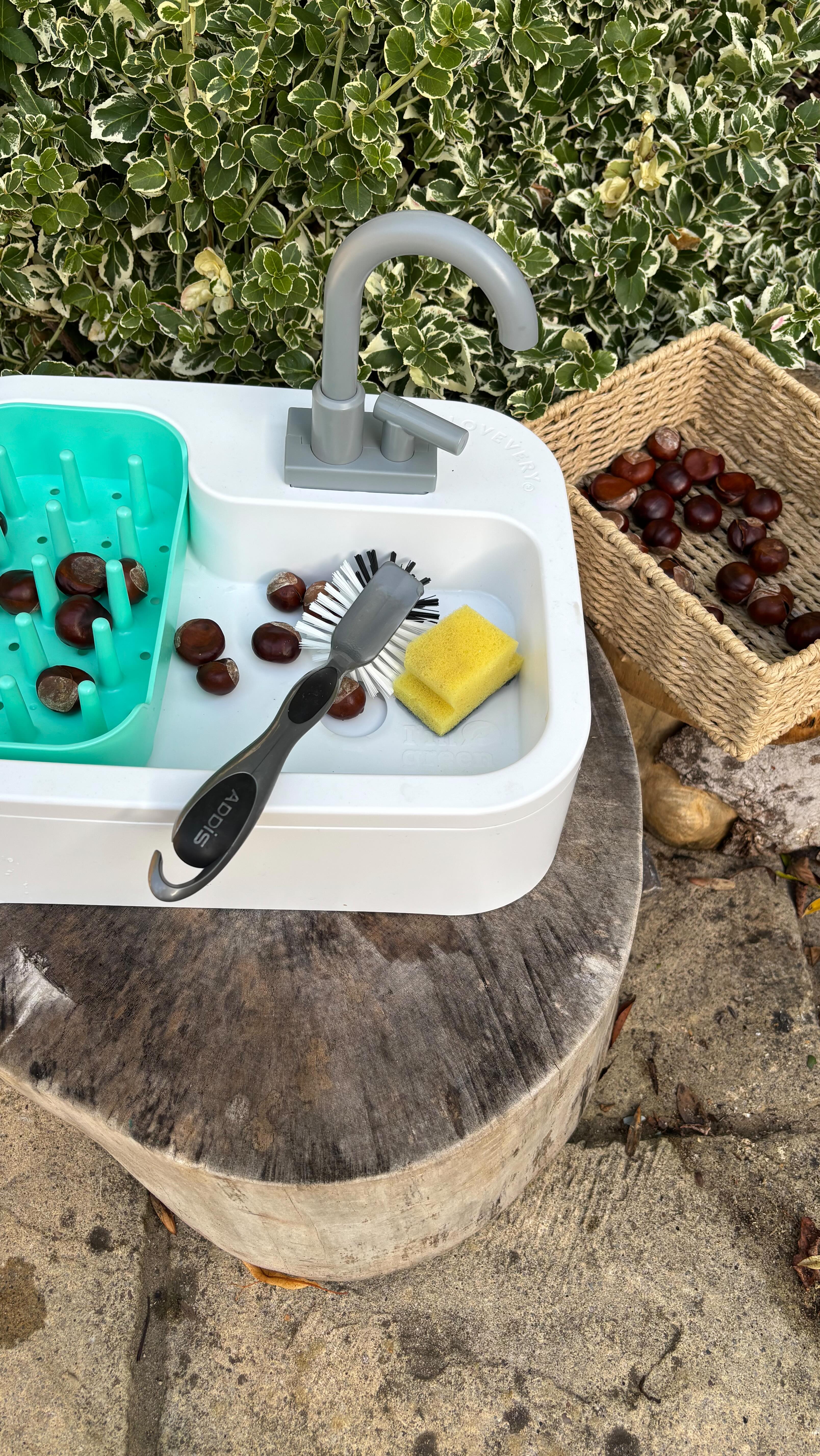 Instagram post by @early_years_steph for Lovevery. Caption reads: [...] Water Play🍂 

Ad| Using our....