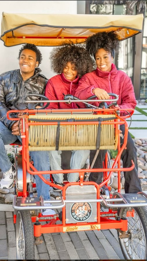 Instagram post by @raisinggreatnessofficial for Hilton Hotels & Resorts. Caption reads: Let’s get ready for summer family vacations! You....