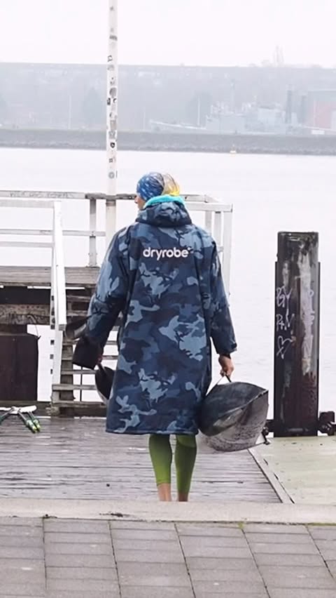 Instagram post by @wassermaxe.hoff for dryrobe. Caption reads: [...] on the Kieler Förde. Good thing my @dryrobe....