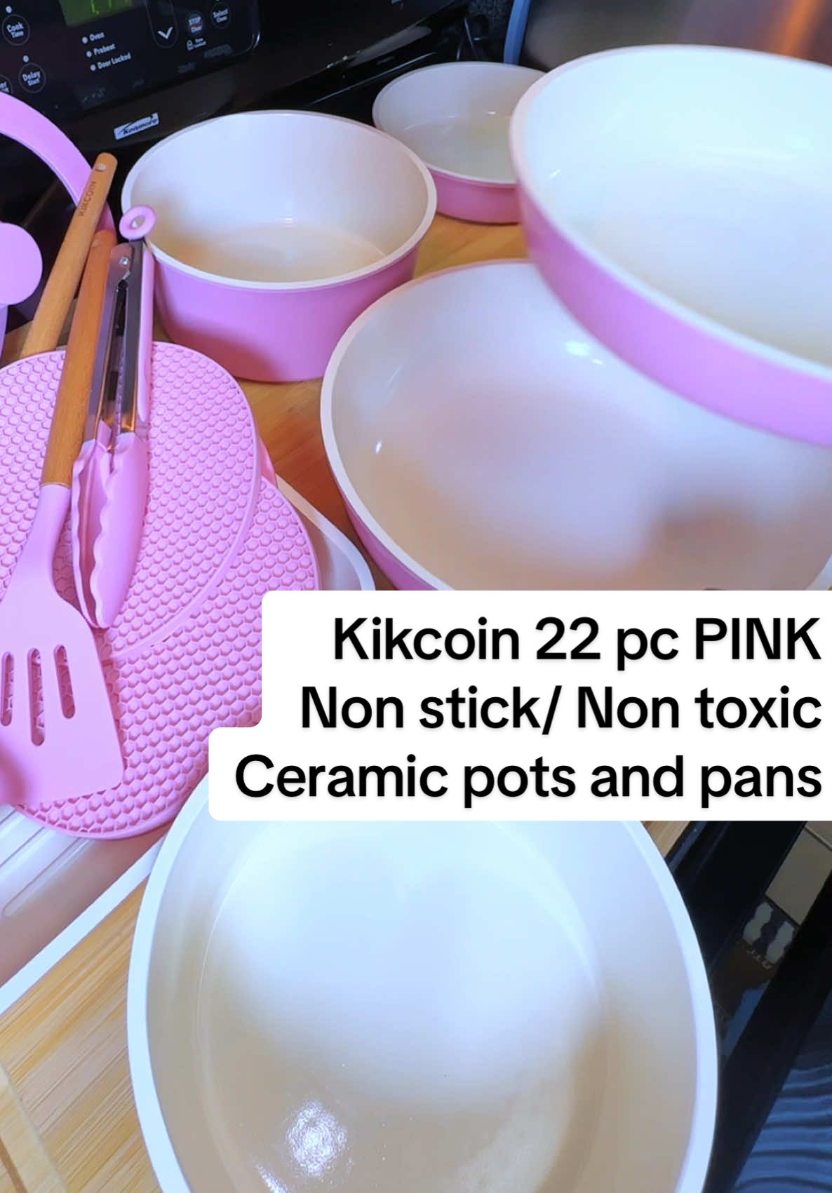 TikTok post by @authenticallystacy for Kikcoin. Caption reads: [...] this pink cookware set on her stove.....
