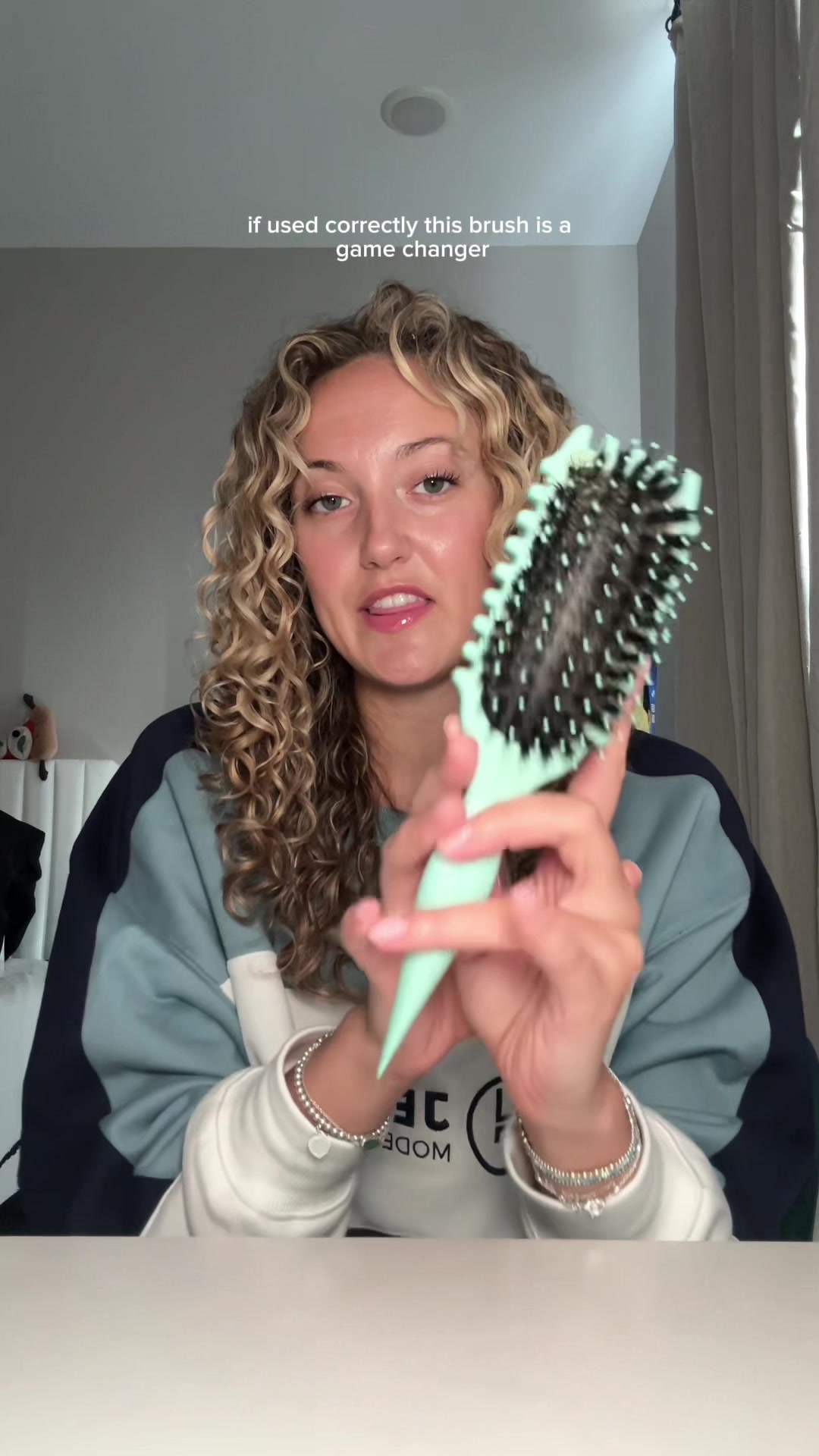 TikTok post by @hannahhnotmontanaa for BounceCurl. Caption reads: Canceling the @BounceCurl brush?! Not on my watch....
