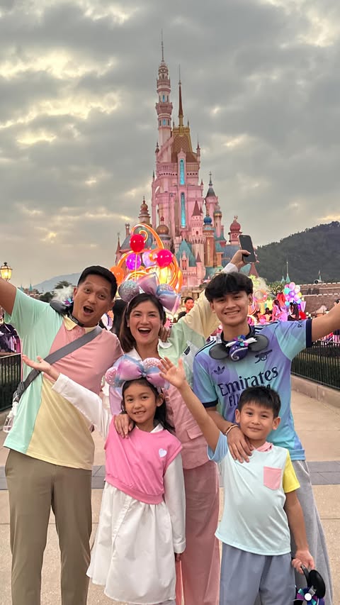 Instagram post by @camilleprats for Hong Kong Disneyland. Caption reads: Still hungover from our family trip to witness the....