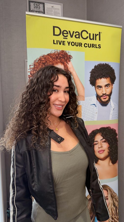 Instagram post by @laladoghmi for DevaCurl. Caption reads: I never knew my curly hair could look this vibrant....