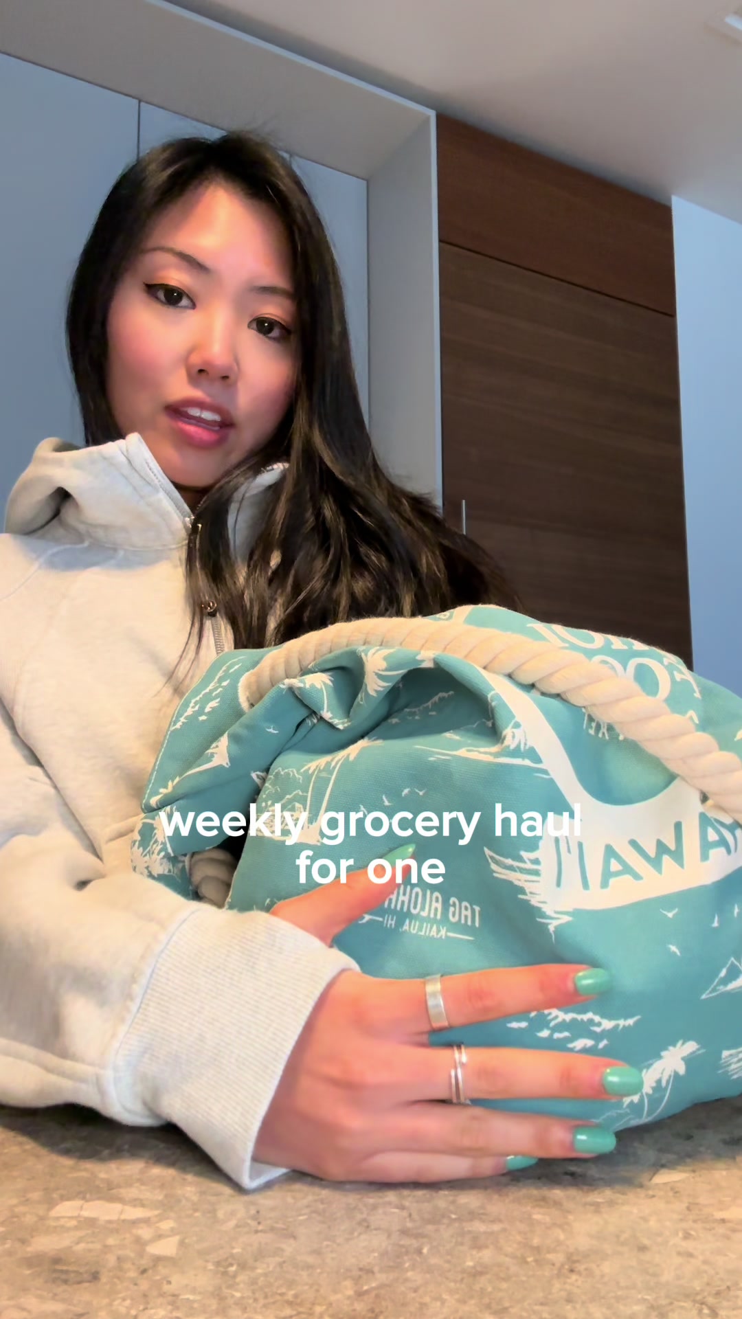 TikTok post by @ashleymlin for Whole Foods Market. Caption reads: $60 @Whole Foods Market grocery haul for ☝🏼 .