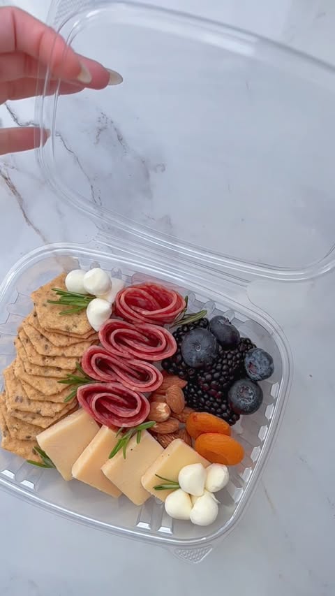 Instagram post by @charcuterie_n_things for Crunchmaster Crackers. Caption reads: [...] beach-friendly. Packed with: •....