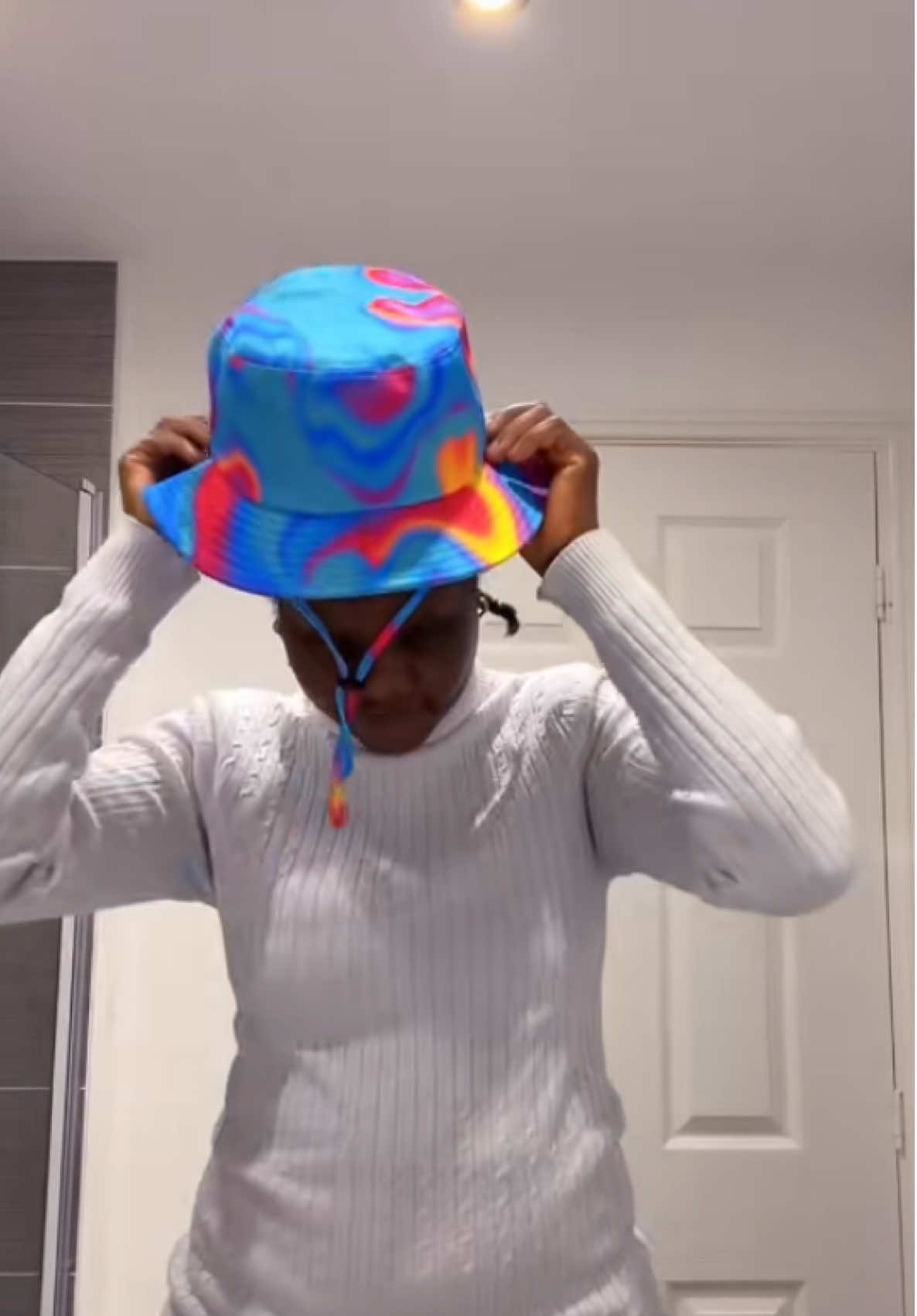 TikTok post by @mummylove.ceo for Liquid London. Caption reads: #women #summer #bucket #hat #TikTokMadeMeBuyIt....