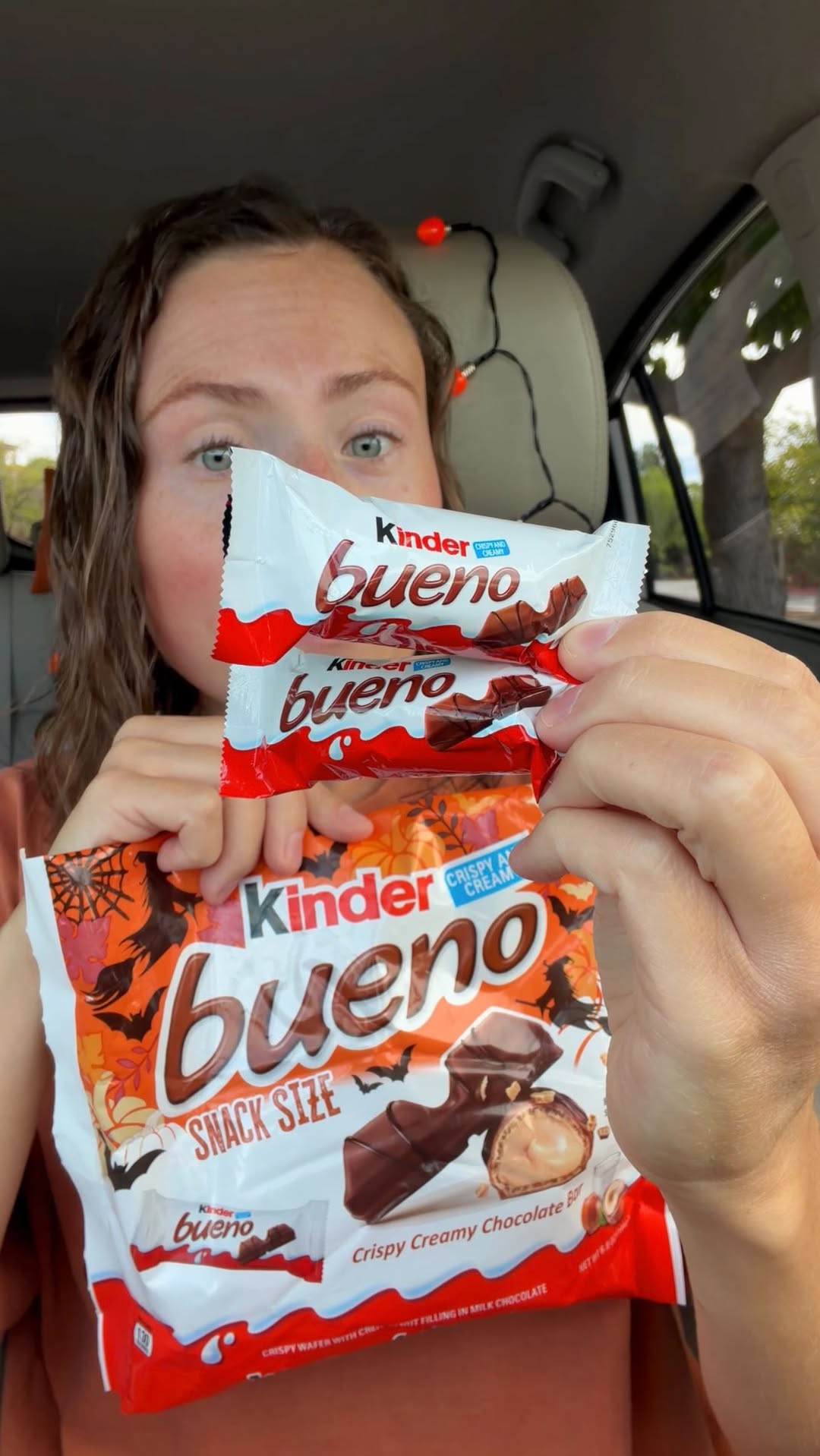 Instagram post by @morganchomps for Kinder. Caption reads: #ad Have trick or treaters find @kinderbuenous in....