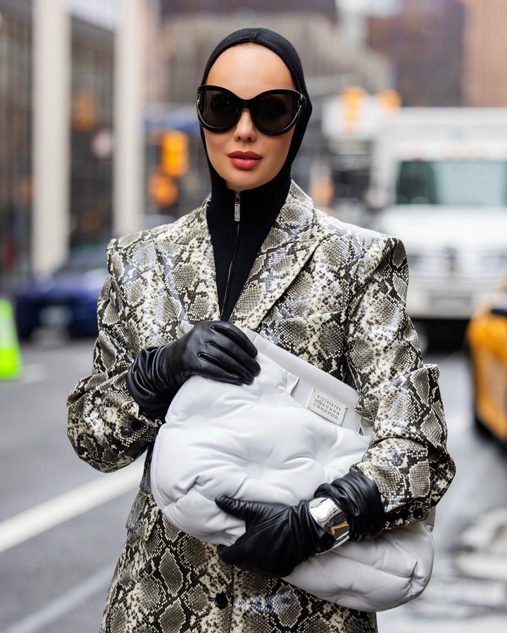 Instagram post by @annieestrin for PINKO. Caption reads: In 2025, fashion emphasizes boldness and....