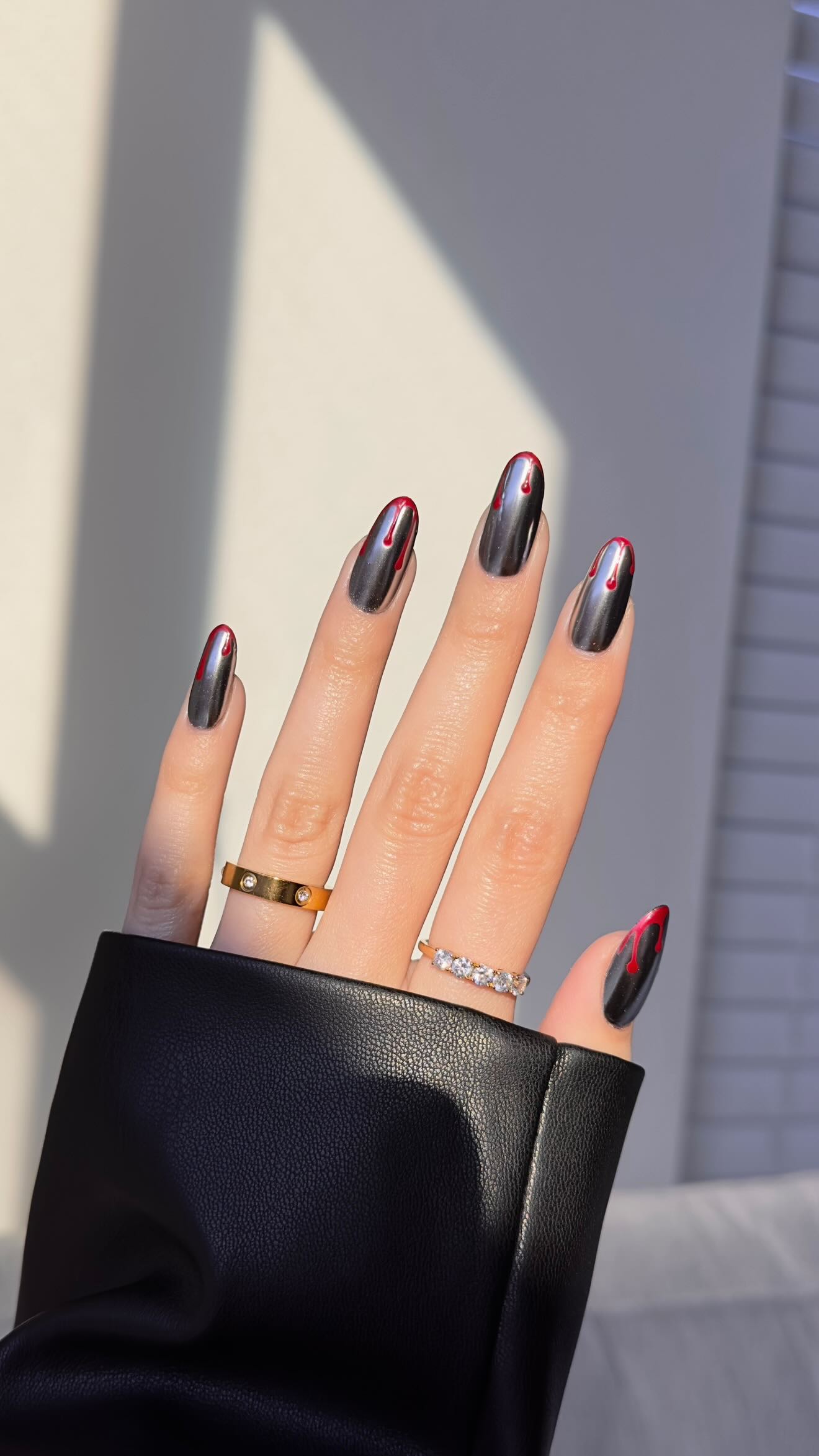 Instagram post by @jesslizs for Refinery29. Caption reads: minimal spooky nails for the season 💿🩸

comment....