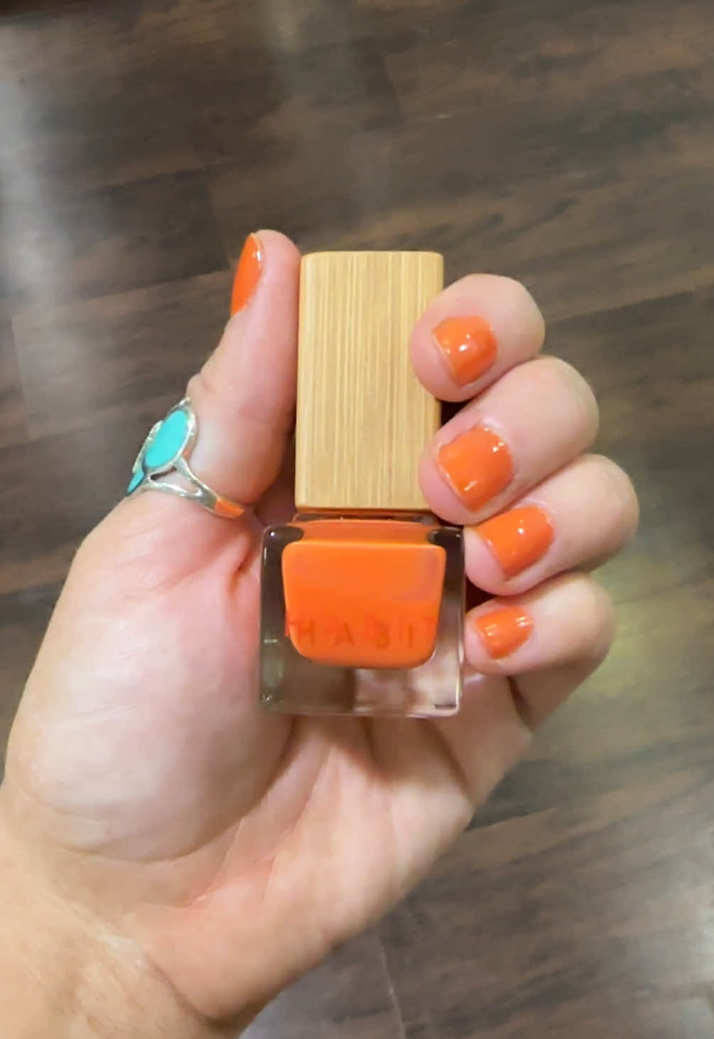 TikTok post by @thedesertgroove for Habit Cosmetics. Caption reads: This color is so good! 🍑🧡🍊 @Habit Cosmetics....