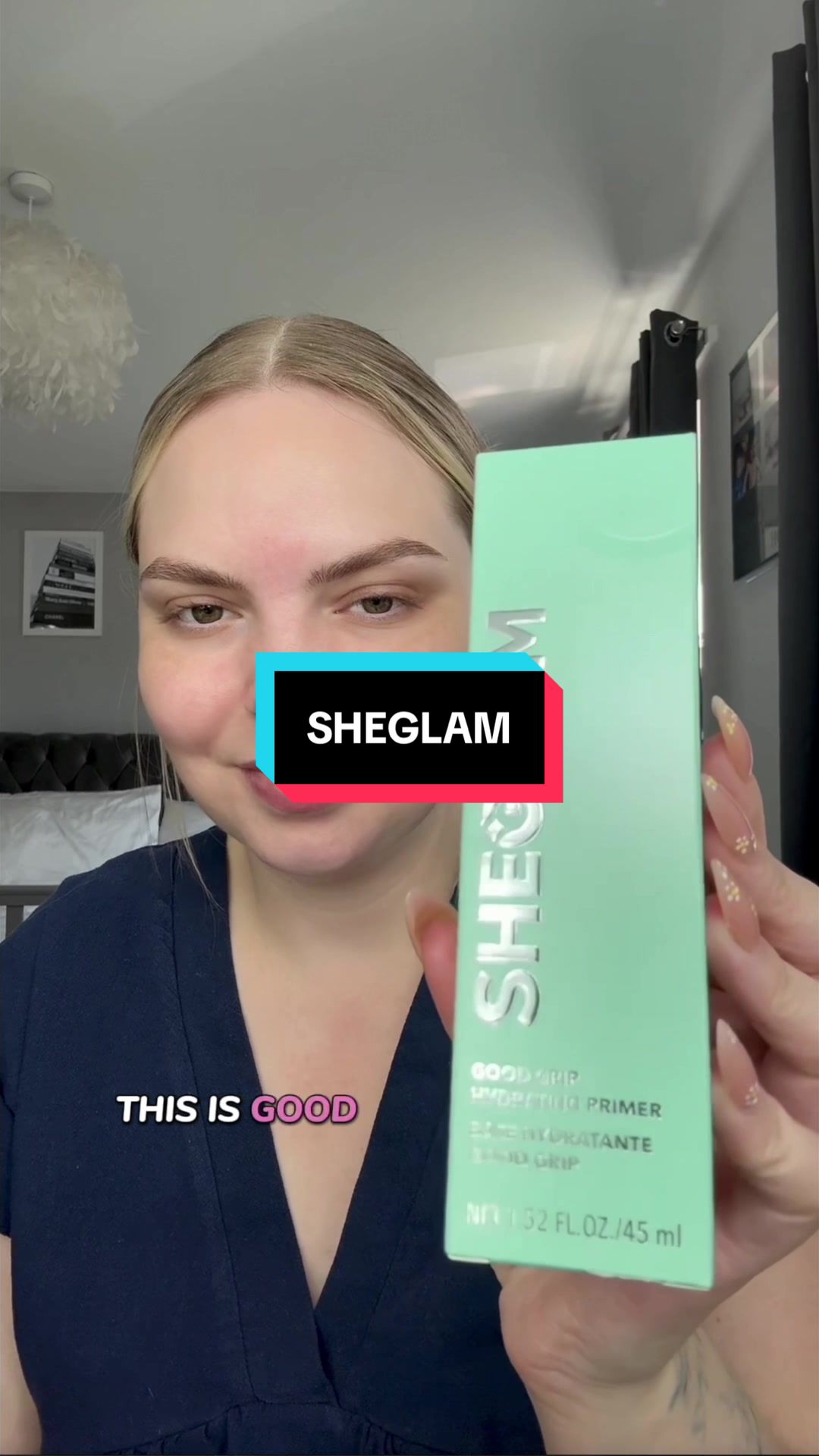TikTok post by @thesmfamily for SHEGLAM. Caption reads: Ever seen cotton stick to your face? 🤯 Good Grip....