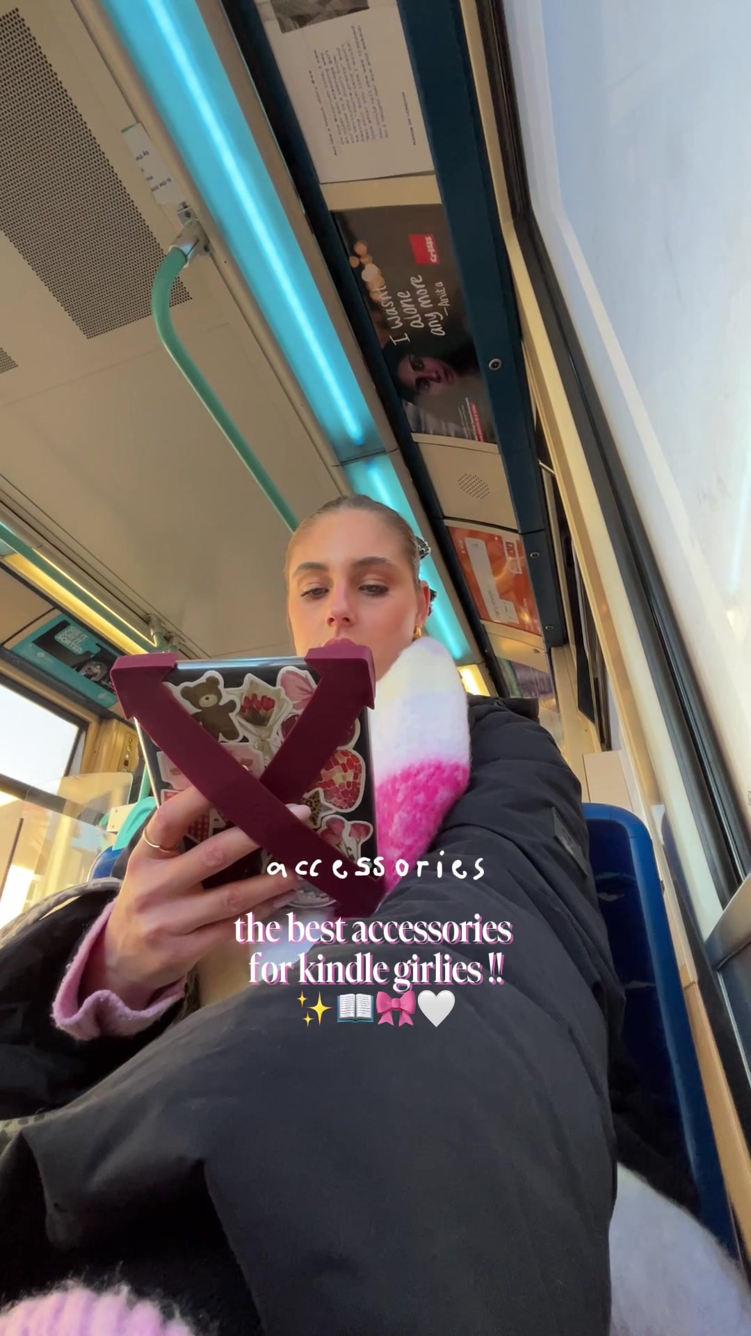 TikTok post by @kelseysreadingg for Strapsicle. Caption reads: the best kindle accessories for the girlies who....