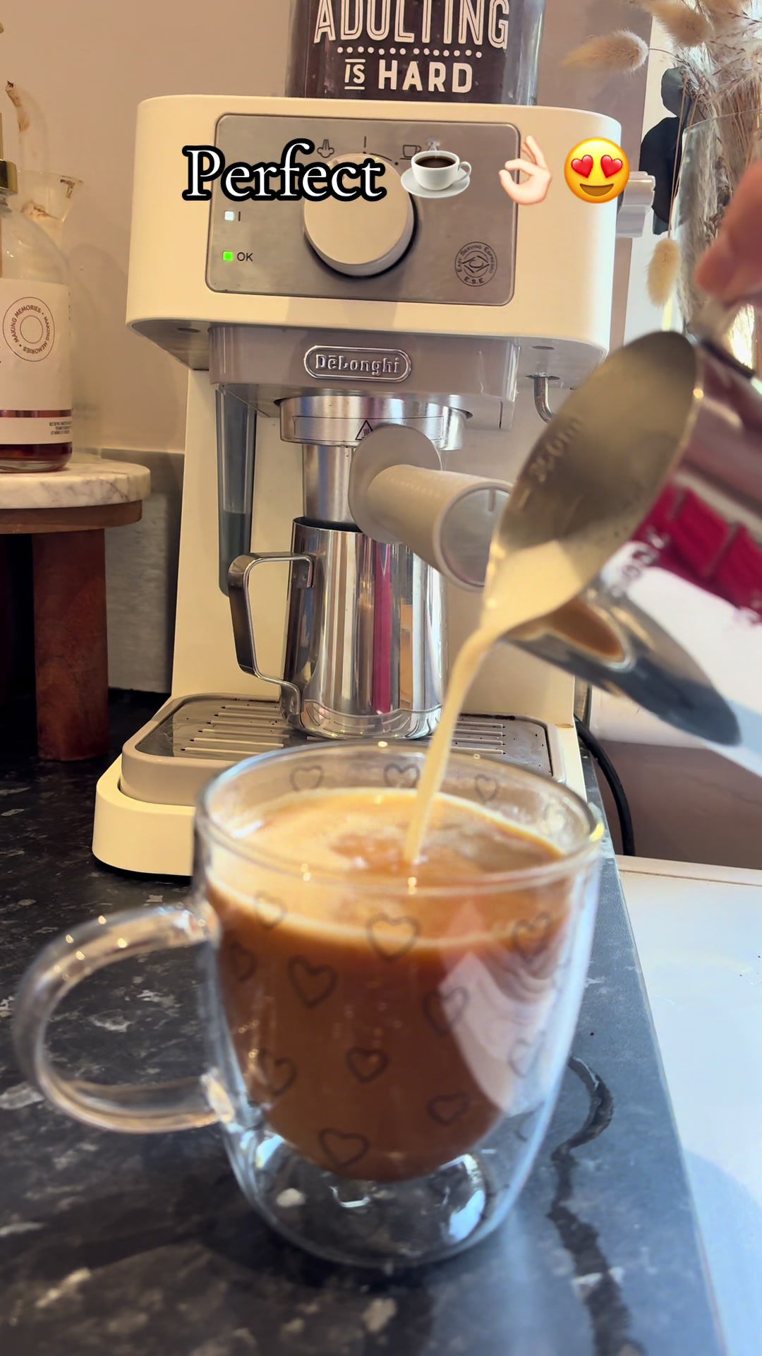 TikTok post by @pitchyroo.family for MYOM. Caption reads: [...] with the easiest machine @DeLonghi @myomshop....