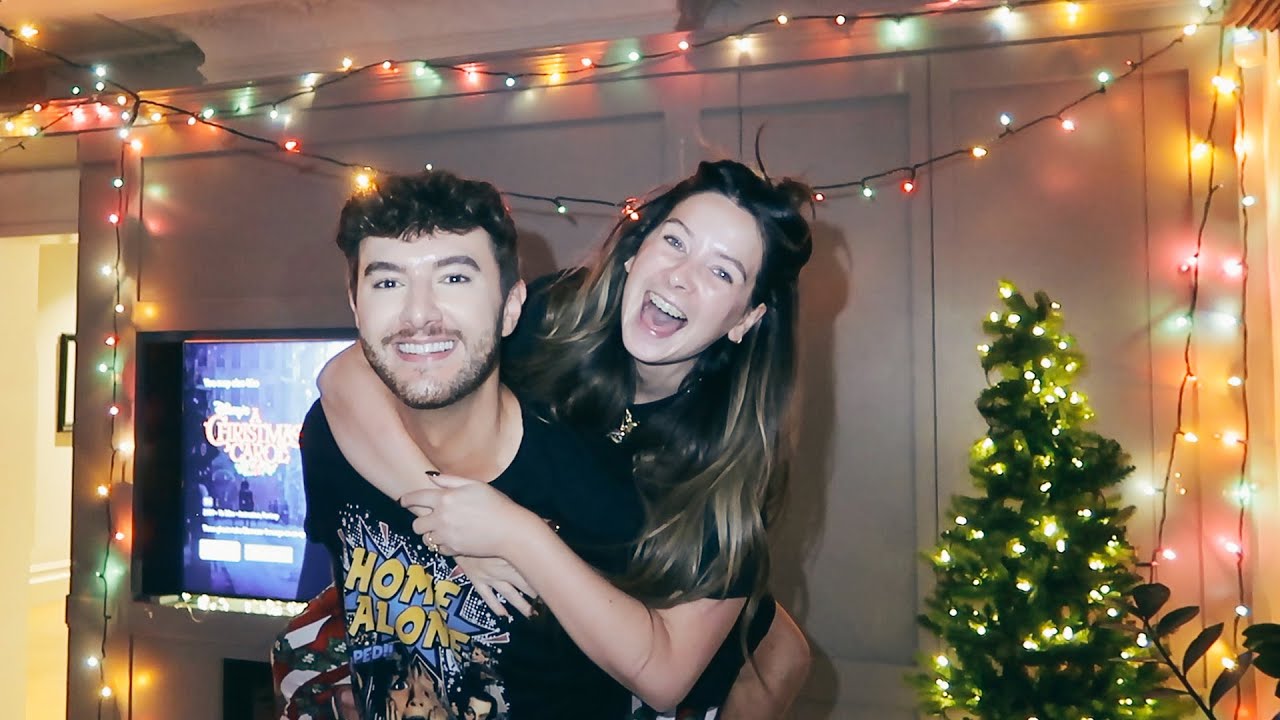 YouTube post by @ZoeSugg for Symprove. Caption reads: Faux Christmas With Mark & A Decade of Friendship.