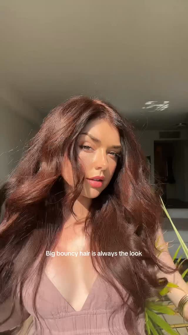 Instagram post by @chloezadori for L’ange Hair. Caption reads: Big bouncy hair is all I want 🤍 @langehair Move....