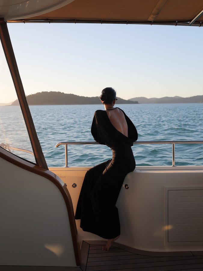 Instagram post by @janithanperera for Mecca Cosmetica. Caption reads: 🍊@meccacosmetica @hamiltonislandraceweek....