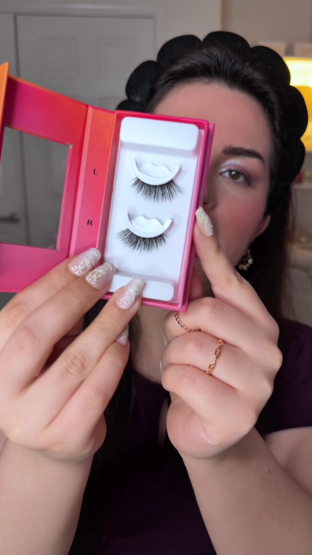 TikTok post by @maryam.alnasiri for Lilly Lashes. Caption reads: No glue needed only your body heat 😍 half lash....