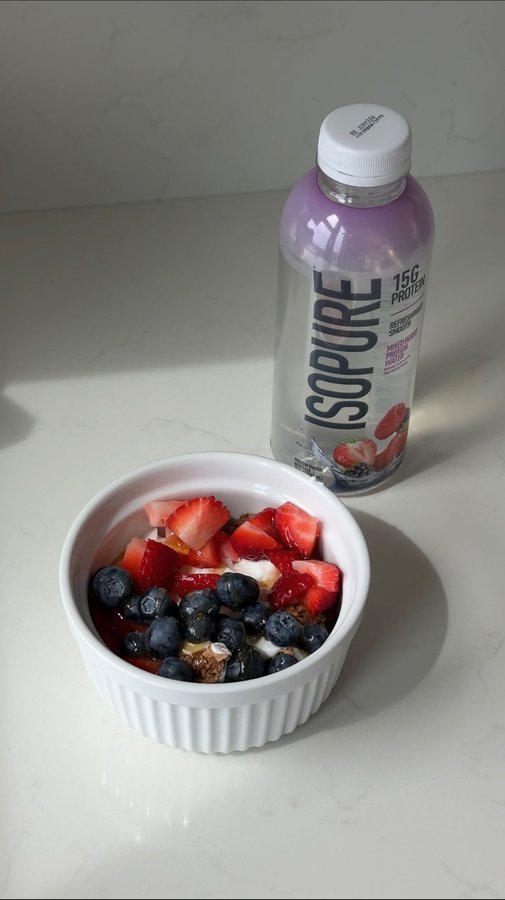 Instagram post by @brookemason for The Isopure Company. Caption reads: #IsopurePartner time stamped morning in my life....