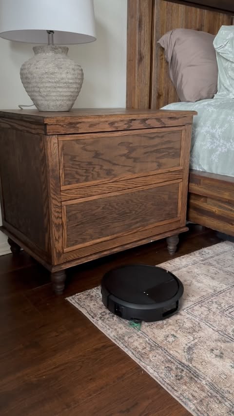 Instagram post by @yourlifeiswhatyoumakeit for iRobot. Caption reads: [...] inside a faux nightstand! Now my @irobot....