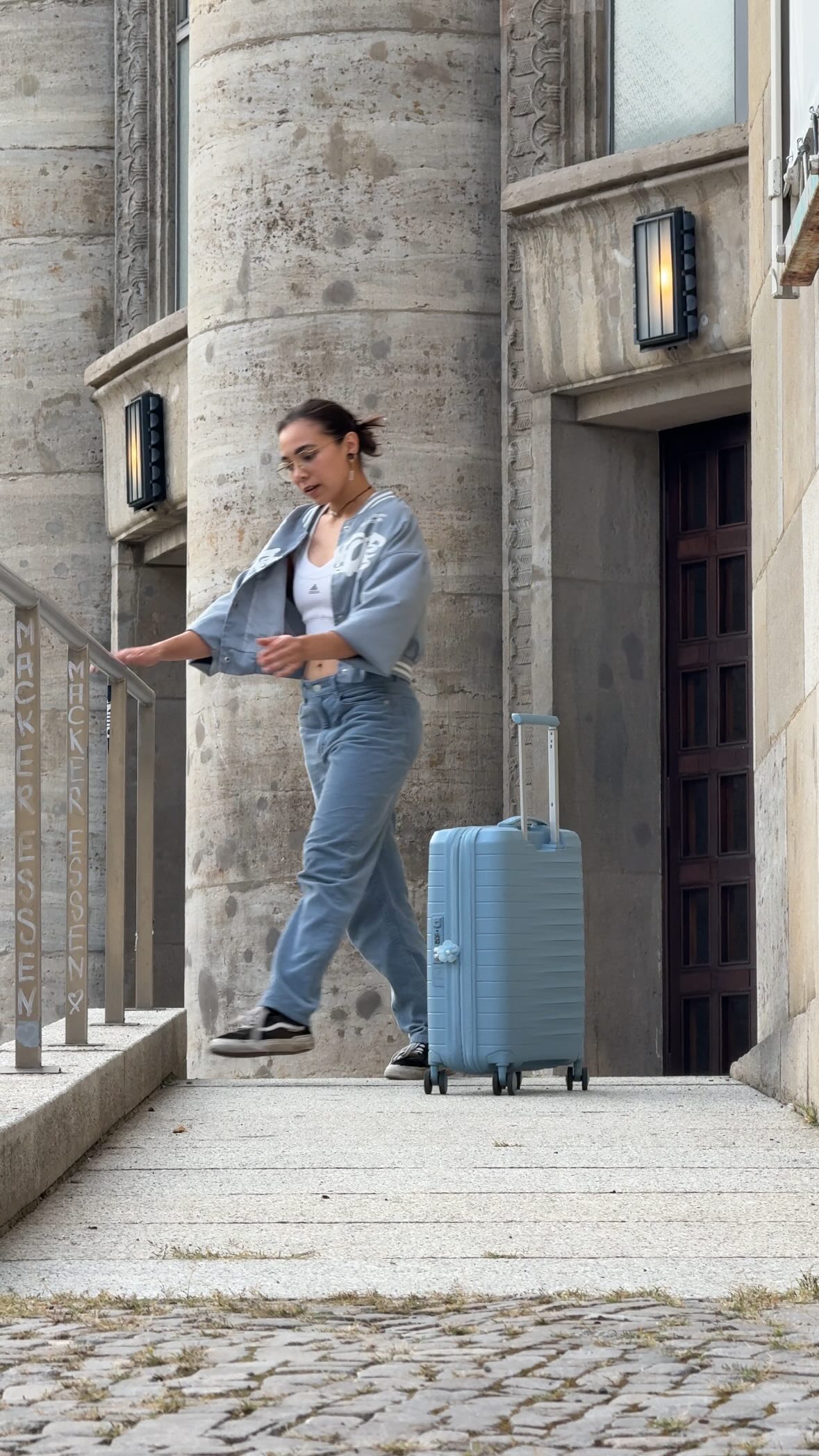 Instagram post by @silky.zigzag for American Tourister. Caption reads: #sponsored - He tried to sneak off on a solo....