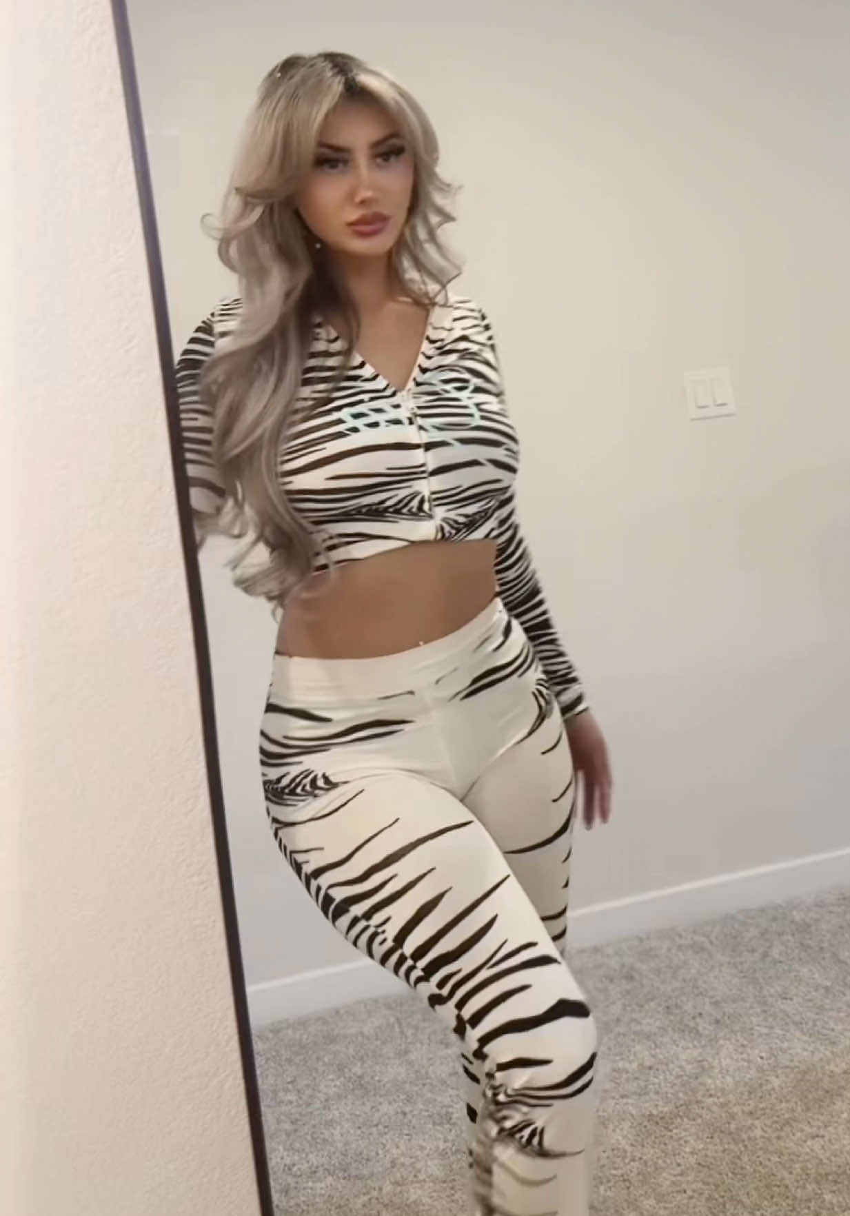 TikTok post by @niccoolee_xo for I AM GIA. Caption reads: @I.AM.GIA #iamgia #tryon #zebra.