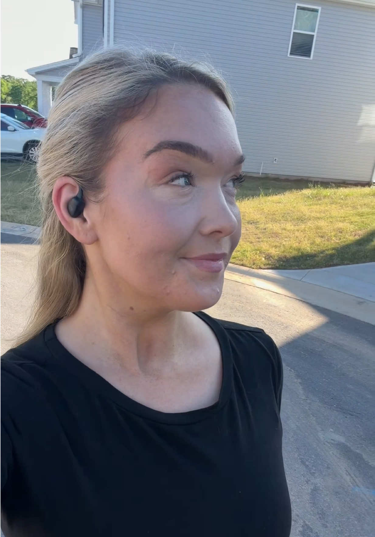 TikTok post by @shellikathryn for Raycon. Caption reads: I’ve been using the Raycon Essential Open Earbuds....
