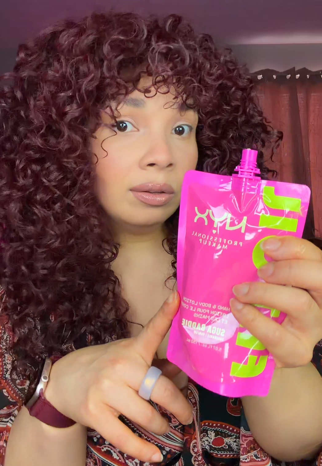 TikTok post by @cardis.ego for NYX Professional Makeup HR. Caption reads: New NYX SUGA BADDIE Hand & Body Lotion 💕✨....