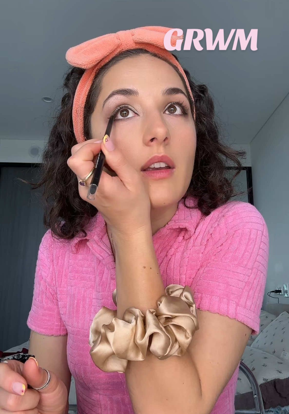 TikTok post by @jasminehoags for MCoBeauty. Caption reads: Which outfit? 1, 2 or 3 🩷 You can grab these....