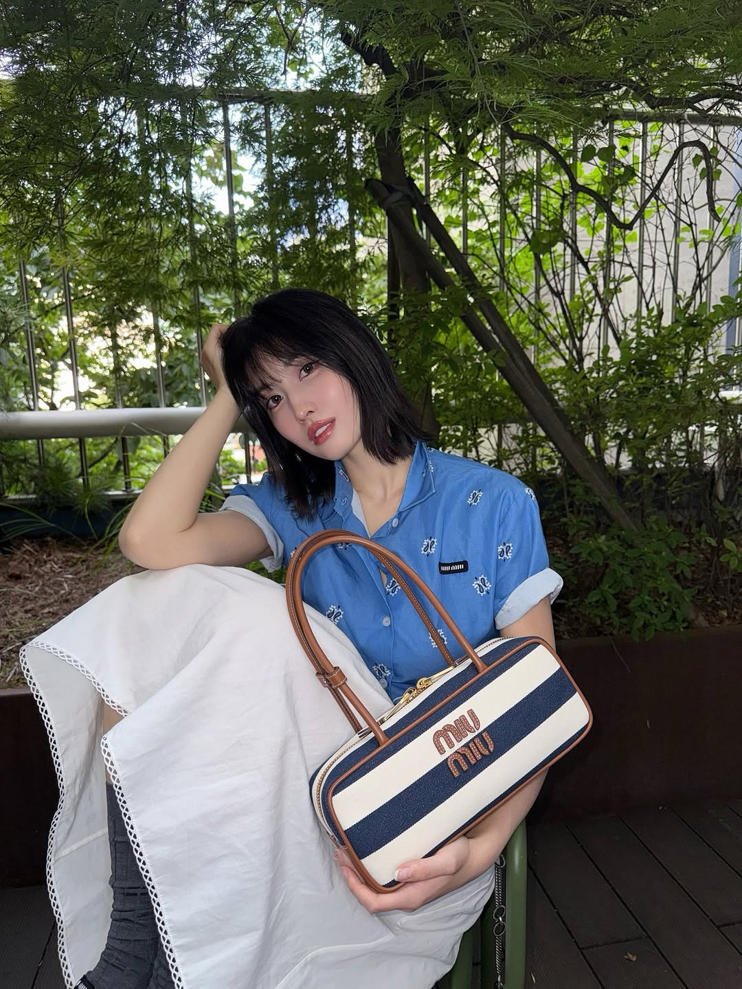 Instagram post by @momo for Miu Miu. Caption reads: “Beau”, the perfect new Miu Miu bag for....